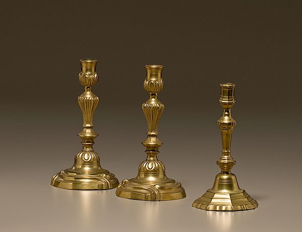 French Brass Candlesticks, : French Brass Candlesticks, mid-18th century, lot of 3. Includes a pair of bellmetal French candlesticks in the rococo style, height 10 in., and an example with knopped, baluster stem on a stepped, s