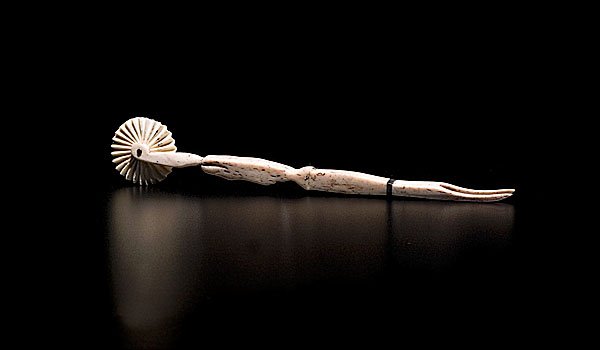 Whale Bone and Ivory Jagging Wheel : Whale Bone and Ivory Jagging Wheel American, ca 1860, having a handle in the form of a sperm whale, with a fluted ivory wheel on one end, a two-pronged fork on the other, and a single baleen band ne