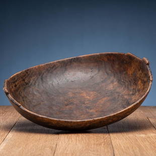 Eastern Woodlands Elm Burl Bowl: thin walled and with sides carved into the form of the Manitou; remnants of brass tacks; accession number inked on base height 4.5 in. x length 16 in. x width 14.25 in. 19th century cf. Powers,