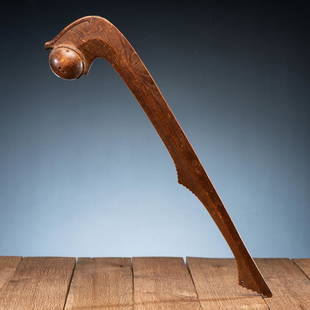 Otoe Ball Club: carved of ash or chestnut; burl head is topped with an otter or Underwater Panther; lower portion of haft has scalloped edges and is pierced through for attachment length 26 in. mid-19th century 