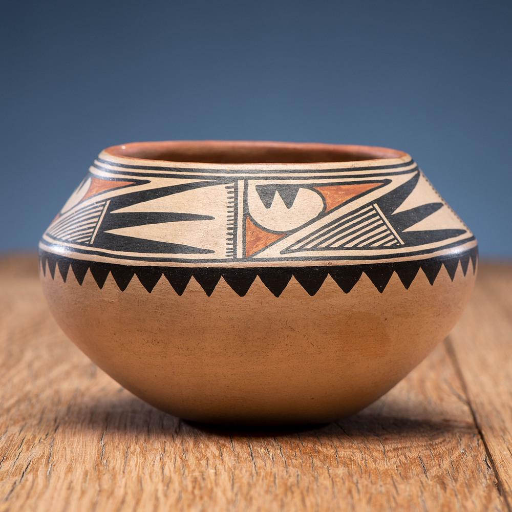 Maria Martinez (San Ildefonso, 1884-1980) Polychrome: designed with a band of finely hatched winged elements around rim, signed Marie height 3.5 in. x diameter 5.25 in. 1920-1925
