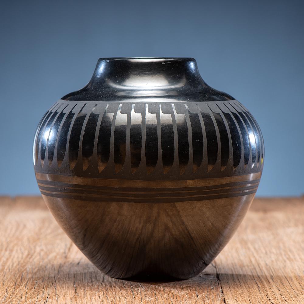 Santana and Adam Martinez (San Ildefonso, 1909-2002 /: highly polished vase with repeating feather design, signed on base height 6.25 in. x diameter 7.5 in. mid-20th century