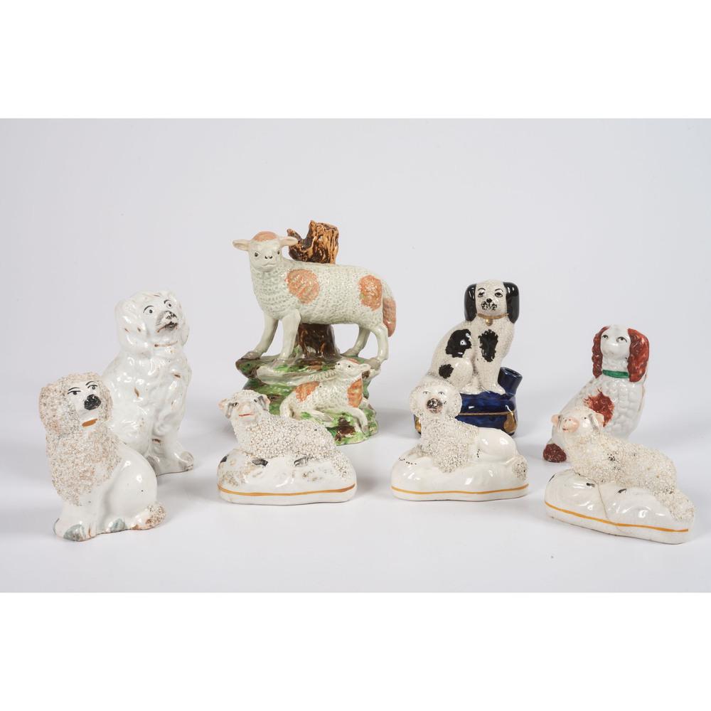 Eight Staffordshire Animal Figures: 19th Century including sheep and dogs. Height of tallest 5 1/4 inches. Provenance: Property from the Estate of James A. Sanders, Evansville, Indiana Hindman is honored to present property from the Est