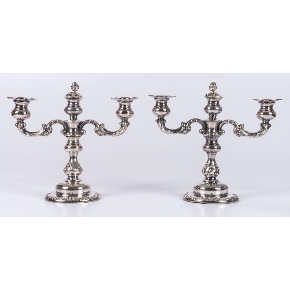 A Pair of German Silver Candelabra: 20th Century weighted, marked for Sterling. Height 10 3/8 inches.
