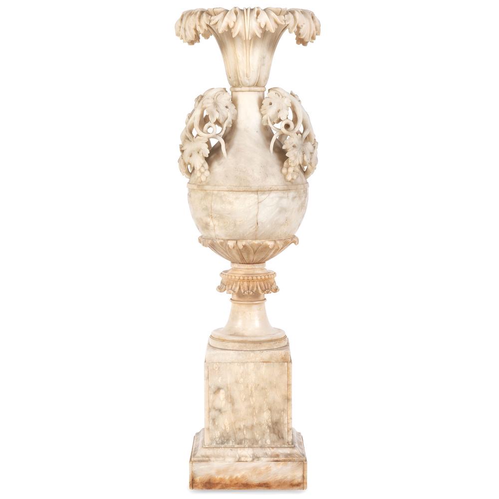 An Italian Carved Alabaster Urn: Height 38 1/4 inches. Provenance: Property from Brown Brothers Automotive formerly Brown Brothers Cadillac, Louisville, Kentucky