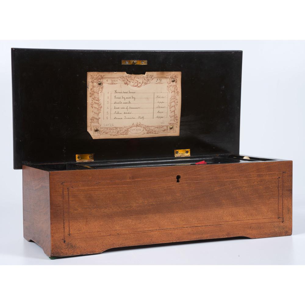 A Swiss Six-Tune Cylinder Music Box: 19th Century numbered 20134 on song list. Height 5 x length 14 1/4 x depth 6 3/4 inches.