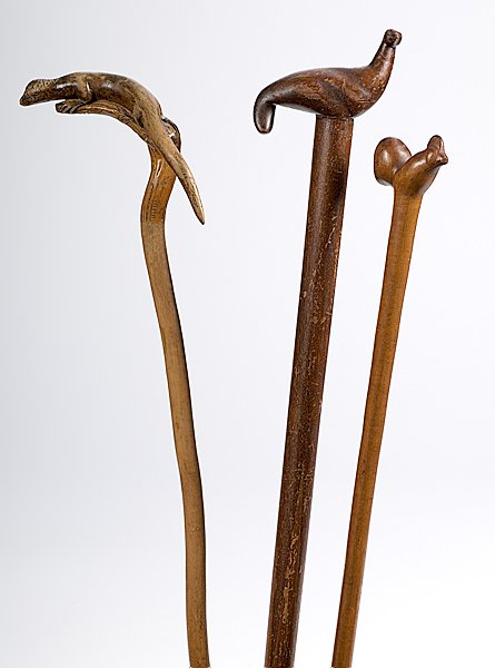 Animal Figural Canes : Animal Figural Canes Lot of three includes: one carved seal, stained and affixed to the top of a pool cue; lg. 36.5 in. PLUS a wonderfully carved lizard, with polished look, perched on the handle of