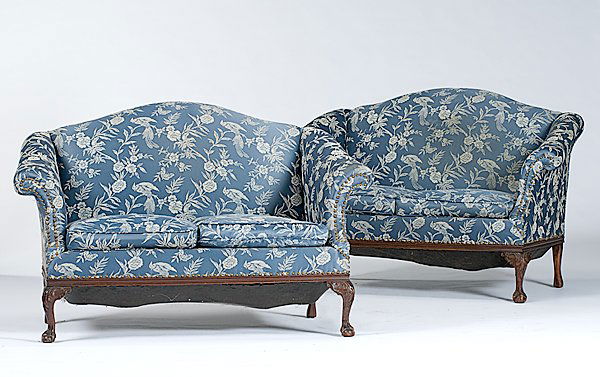 Pair of Chippendale-style Settees : Pair of Chippendale-style Settees American, late 19th/early 20th century, a pair of Chippendale-style camel-back settees with blue brocade upholstery and two seat cushions; ht. 36, lg. 58, dp. 33 in