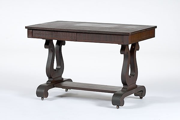 Late Classical Library Table : Late Classical Library Table American, ca 1835-1840, of mahogany and mahogany veneers, the top with rounded corners, two drawers in frieze and a lower shelf attached to lyre-shaped ends, resting on 