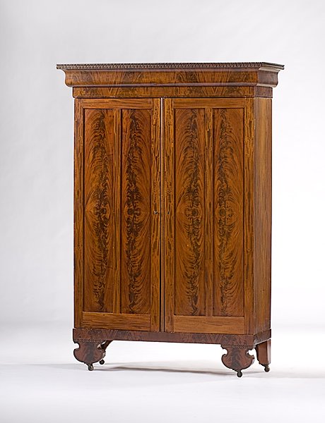 Mahogany Classical Wardrobe : Mahogany Classical Wardrobe, American, ca 1825-1835, a Classical mahogany two-door armoire with deep flared and beaded cornice, paneled crotch mahogany doors, built interior drawers on left side, the 