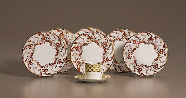 Tiffany & Co. Private Stock Bread Plates and Cup : Tiffany & Co. Private Stock Bread Plates and Cup, American, 20th century. Set of six Tiffany & Co hand-painted bread plates with red swirling floral motif, red script Tiffany & Co. Private Stock, dia.