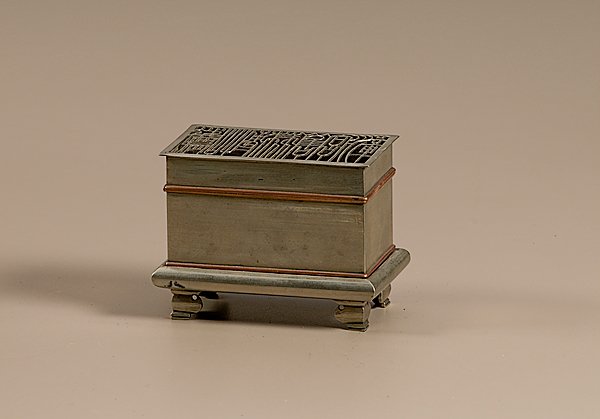 Chinese Incense Seal Timepiece : Chinese Incense Seal Timepiece, An incense seal timepiece, ca 1900. Chinese rectangular timepiece of paktong with copper detailing. Removable lid has pierced detailing over ash tamper and fire templat