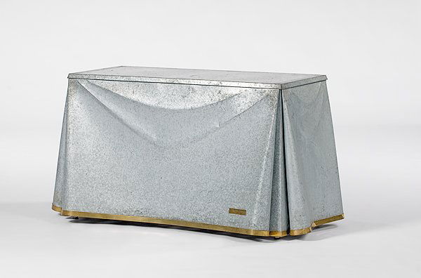John Dickinson Galvanized Steel Table: John Dickinson (American, 1920-1982), Galvanized Steel Table, American, 1970s console table. A galvanized steel table in the form of a draped table with cloth folds and a one inch brass band on the sk