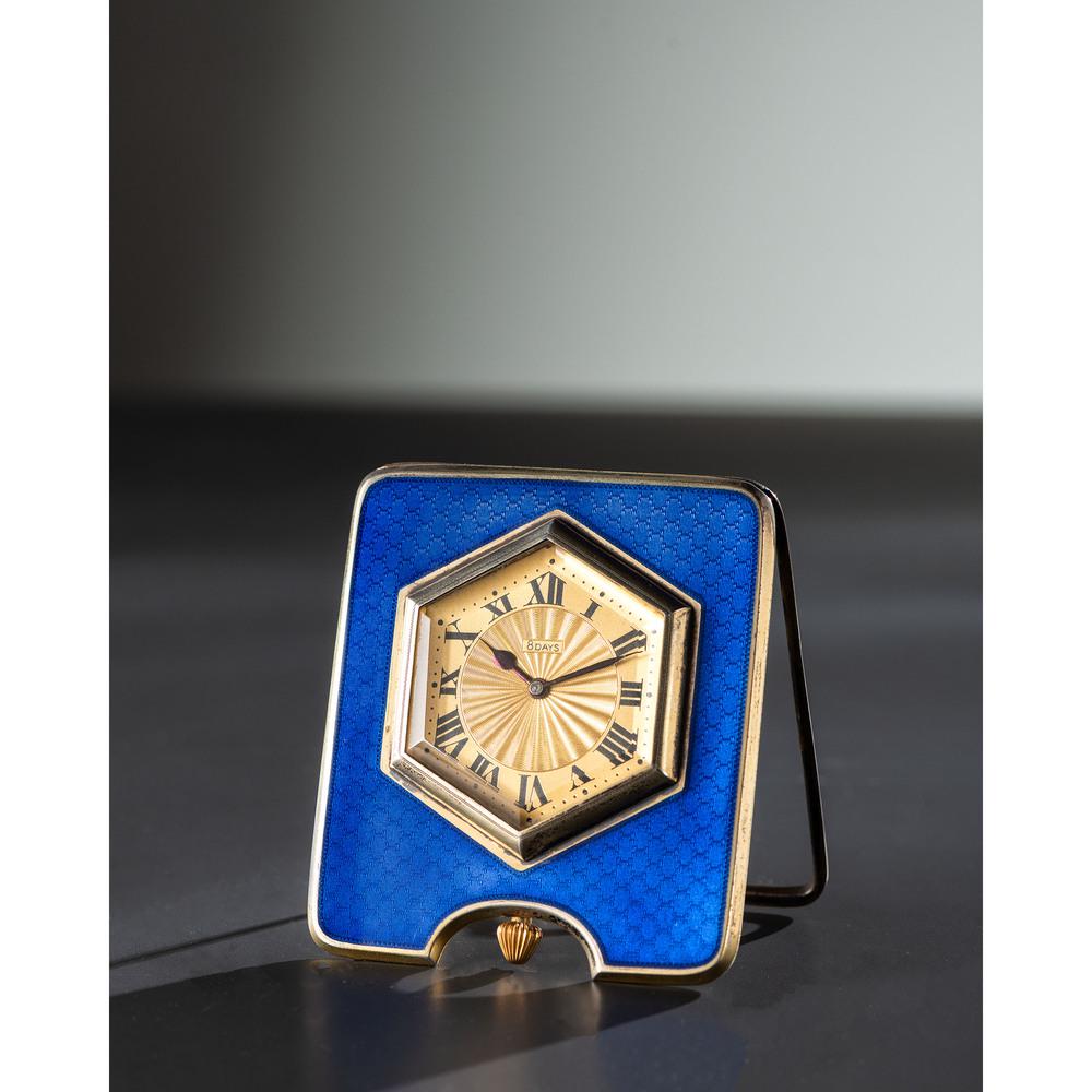 A Sterling Silver and Enameled Desk Clock: American, Early 20th Century A Sterling Silver and Enameled Desk Clock marked on reverse Made For Tiffany & Co. / Sterling 5069-99 AD / 5113 AJ originally a car clock, marked on dial for Majestic Watc