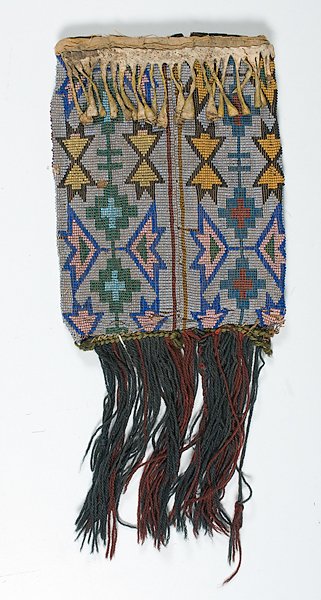 Chippewa Loom Beaded Hide Pouch : Chippewa Loom Beaded Hide Pouch thread-sewn using bead colors of medium blue, pony trader blue, greasy yellow, translucent green, and opalescent; wool fringe hangs along the base of the bag; backsid