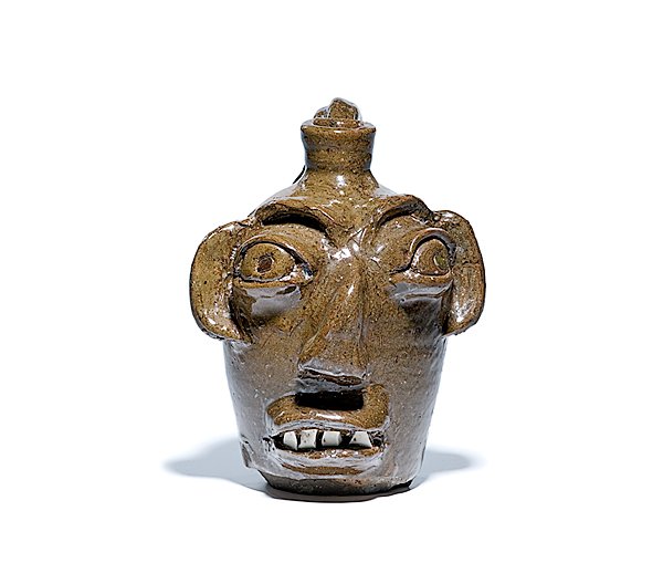 Burlon Craig North Carolina Face Jug : Burlon Craig North Carolina Face Jug American, mid to late 20th century. Burlon Craig (1914-2002) North Carolina face jug with broken china teeth, base stamped BB Craig, Vale, NC; ht 7.75 in.