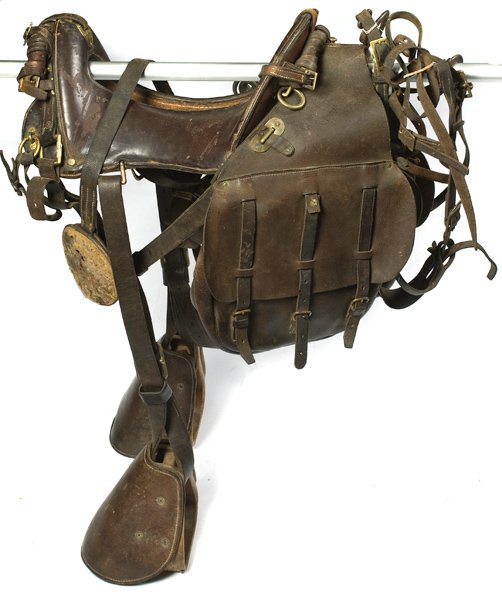 McClellan Model 1917 Saddle : McClellan Model 1917 Saddle Pommel with brass escutcheon marked 11 inch seat. Complete with pair of faintly stamped U.S. saddlebags. U.S. stamped wood stirrups. Bridle with U.S. stamped bits. A few 