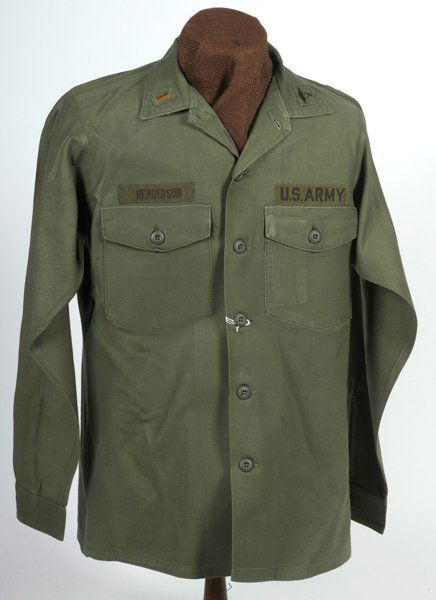 US Army Vietnam Era Medical Officer Fatigue Blouse: U.S, Army Vietnam Era Medical Officer's Fatigue Blouse ID'd to Henderson, 2nd Lieut., medical patch on collar, on half mannequin.