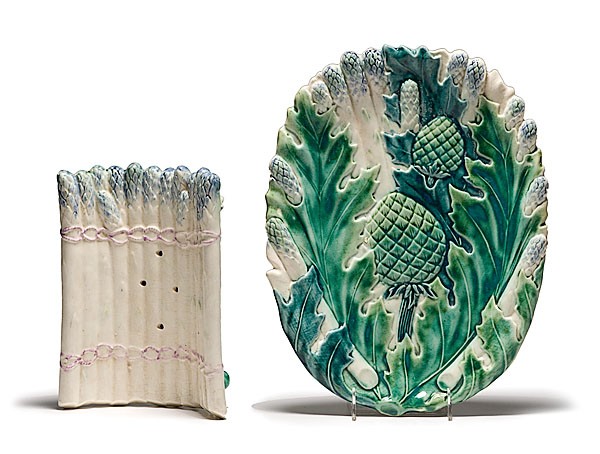 Majolica Asparagus Cradle and Under Plate : Majolica Asparagus Cradle and Under Plate Continental, 20th century, a footed Majolica asparagus cradle; ht. 3.5, wd. 9 in; and a Majolica platter decorated with molded asparagus and pineapples; lg.