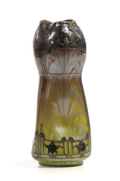 Loetz Silver Overlay Glass Vase : Loetz Silver Overlay Glass Vase Continental, 20th century. A corset shaped three-sided Loetz-style glass vase in gold and gray glass with ornate stylized silver overlay; ht. 10 in.