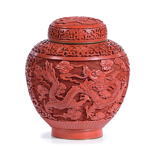 Chinese Cinnabar Red Covered Jar : Chinese Cinnabar Red Covered Jar Chinese, 19th century. Bulbous form lidded jar with carved dragon and flowers in bright red cinnabar; ht. 7 in. Property from the Collections of Dorothy Painter, C