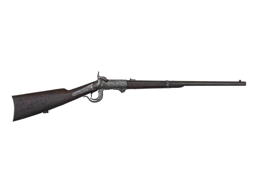 5th Model Burnside Carbine: .54 caliber. 21" barrel. SN: 8897. Blued and color casehardened finish, smooth walnut stock and forend. Standard Burnside markings, mismatched serial number "9930" on the breech block. Obverse butt st