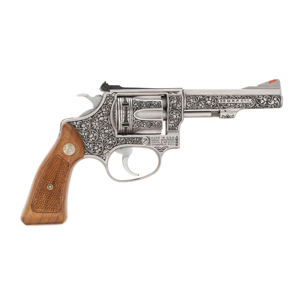 * Custom Engraved Smith & Wesson Model 651 with: .22 MRF. 4" barrel length. SN: AHA6779. Highly engraved double action revolver with a fluted 6-shot swing out cylinder and adjustable notch and ramp sights. Satin steel finish and checkered walnut gri