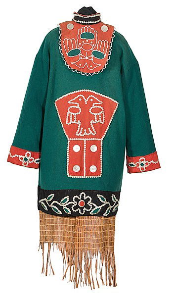 Tlingit Wool Tunic with Cedar Bark Skirt : Tlingit Wool Tunic with Cedar Bark Skirt Thread-sewn using white, black and green wool; tunic designed with a double-headed bird contained within an outline of a copper plate; tunic enhanced with sh