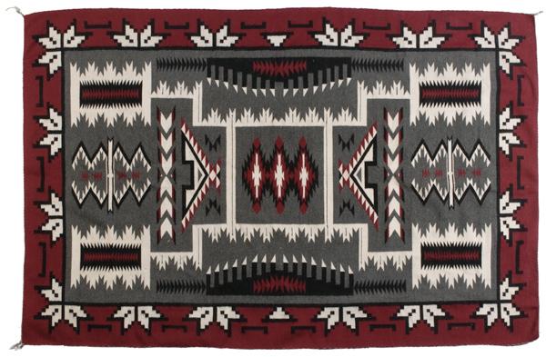 Navajo Storm Pattern Weaving : Navajo Storm Pattern Weaving Woven using colors of red, black, gray, and cream; with center panel filled with the traditional storm pattern and bordered with halved and quartered squash blossoms, 92