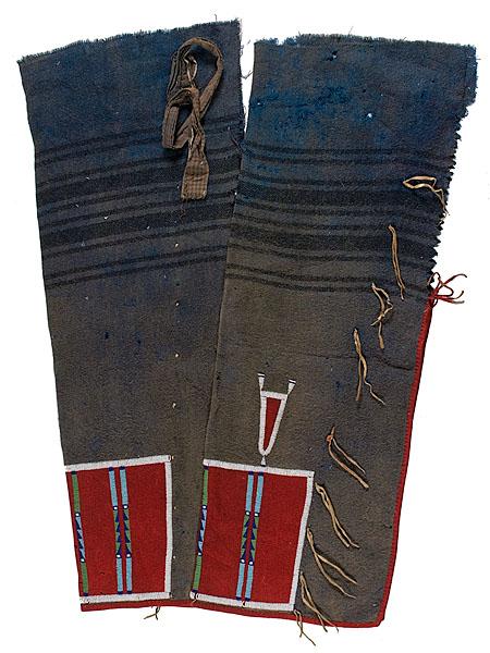 Crow Beaded Wool Leggings : Crow Beaded Wool Leggings Thread-sewn and beaded on blue and red wool; bead colors used include white, light blue, pea green, and dark blue; paired hide thongs decorate edge of leggings; length 34 i