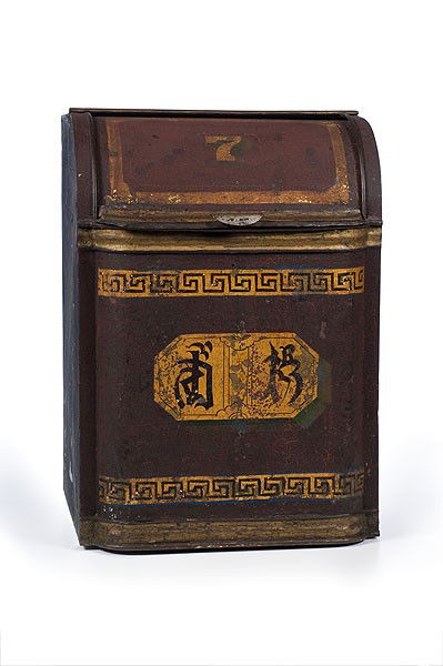 Tin Store Tea Canister : Tin Store Tea Canister Late 19th century, painted tin with gilt bronze painted Asian letters, decorative borders, and numeral 7. Slide lid opens to reveal interior with divided compartment; ht. 24.5