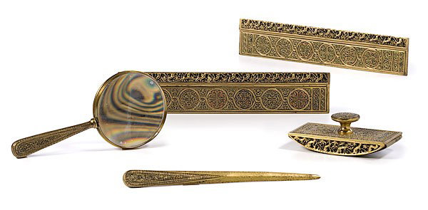 Tiffany Studios "Venetian" Bronze Desk Items : Tiffany Studios "Venetian" Bronze Desk Items American, early 20th century, five Tiffany bronze desk items in the "Venetian" pattern, consisting of magnifying glass, a pair of blotter ends, a blotter