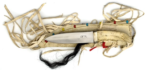 Black Foot Dag Knife by WK : Black Foot Dag Knife by WK 6.5" spear point knife. Jaw bone handle with fringed leather sheath. Blade marked WK. "WK" is from Pioneer, Ohio.
