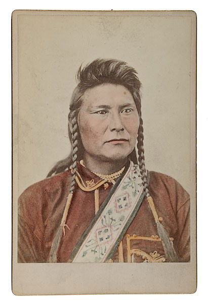 Cabinet Photograph of Chief Joseph by F. J. Haynes: Cabinet Photograph of Chief Joseph by F. J. Haynes Ca 1877. A fine, hand-tinted image, with Haynes' imprint and Colored Cabinets on verso. Taken by Haynes after Joseph's surrender at the end of the