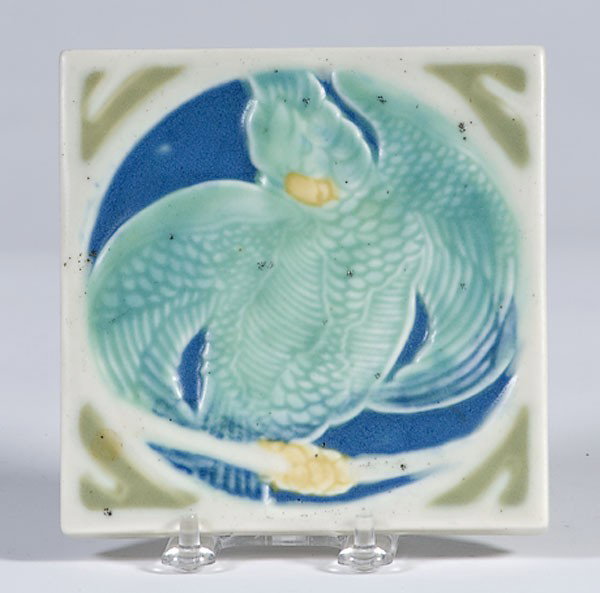 Rookwood Tile Trivet : Rookwood Tile Trivet American, a Rookwood tile trivet with molded design of a parrot on branch, impressed Rookwood logo, shape No. 2043; dated 1928; sq. 5.5 in.