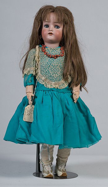 Simon & Halbig KstarR #62 Doll : Simon & Halbig KstarR #62 Doll Bisque socket head incised Simon & Halbig / KstarR / 62, blue flirty eyes, open mouth with four teeth, pierced ears, brown wig, on a ball-jointed composition body; 24