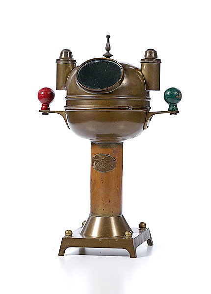 Viking Ship's Binnacle : Viking Ship's Binnacle A Viking brass binnacle with label, floating compass in gimbal under brass hood with viewing port, lidded lantern casings on either side for oil lamps, and an intact quadranta