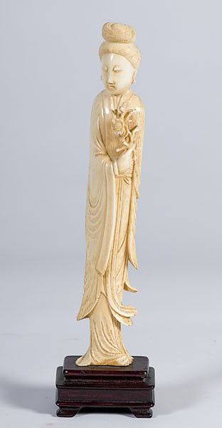 Carved Ivory Figure of Woman : Carved Ivory Figure of Woman A carved ivory figure of woman with flowing robes holding a flower on a wooden base, ht. 10.5 in.