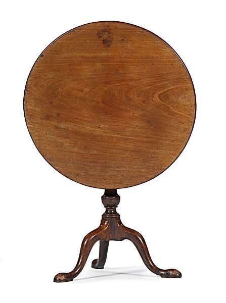 Queen Anne Tilt-Top Tea Table : Queen Anne Tilt-Top Tea Table English, 18th century. A Queen Anne tilt-top tea table in walnut with oak secondary, having a one board top with birdcage on turned pedestal with tripod base, arched le