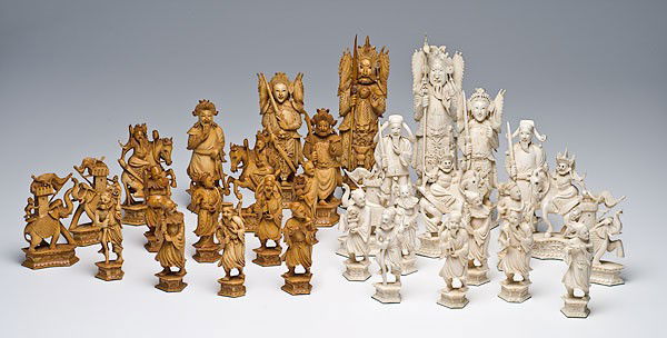 Chinese Carved Ivory Chess Set : Chinese Carved Ivory Chess Set Chinese carved ivory chess set, probably mid-20th century, in natural ivory and stained patinated ivory, the kings and queens each with traditional warrior costume, th
