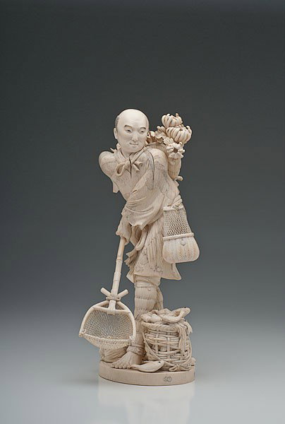 Fine Japanese Okimono Ivory Figure : Fine Japanese Okimono Ivory Figure Meiji period, Okimono, Tokyo school, intricately and finely carved elephant tusk ivory figure of a vendor with fishes, fish baskets and an assortment of irises and