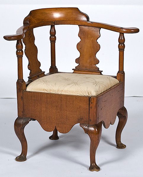 English Queen Anne Corner Chair : English Queen Anne Corner Chair English, ca 1740s, a Queen Anne commode corner chair having a crest rail centering a raised crest with ogival ends, the arms terminating in flat out-turned handrests,