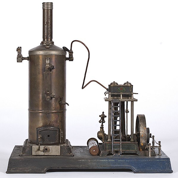 German Doll et Cie Steam Engine Model : German Doll et Cie Steam Engine Model German, early 20th century, Doll & Co. (Doll et Cie) Stationary brass steam engine model with vertical boiler and single flywheel on platform base. Cast iron en