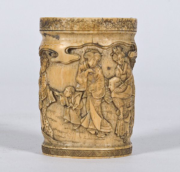 Carved Ivory Brush Pot : Carved Ivory Brush Pot Japanese, early Meiji period, an ivory tusk finely carved, in low relief, scenes of women and children and servants outside of a house; ht. 3.25 in.