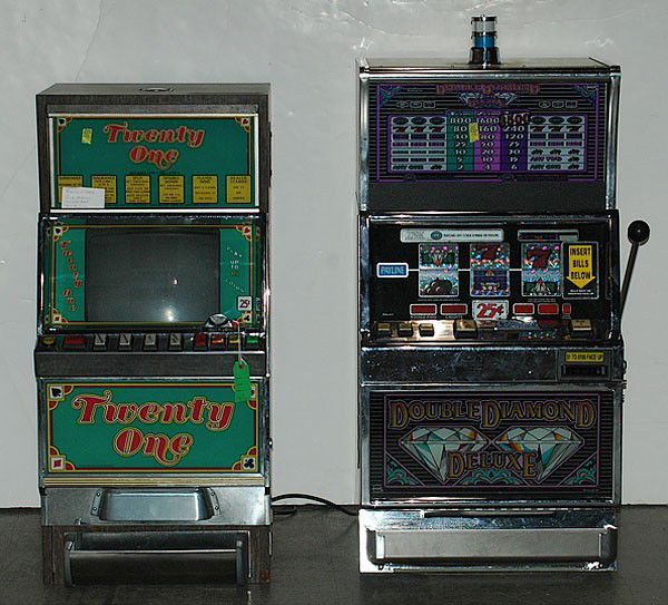 Double Diamond Deluxe Slot Machine and Twenty One : Double Diamond Deluxe Slot Machine and Twenty One 25-cents, ht. 42.5, wd. 21, dp. 22in. Plus a Black Jack Slot Machine; 25-cents; ht. 40, wd. 19, dp. 22.5 in.