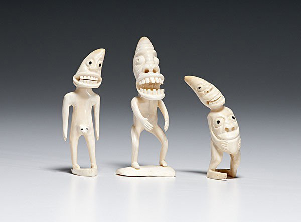 Greenland Eskimo Tupilaks : Greenland Eskimo Tupilaks Lot of 3, all with toothy grins and pointed heads; two have faces emerging from their bellies; baleen eyes, heights 3.5 in. to 5 in. first - second quarter 20th century