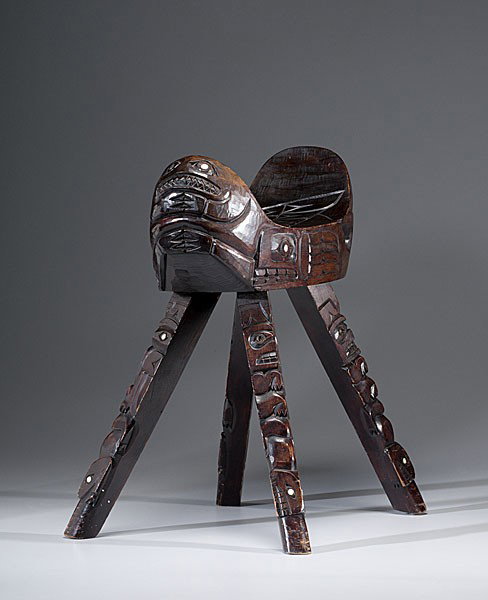 Nootka Carved Stool : Nootka Carved Stool Carved with a Thunderbird on seat; sides with other animal figures; legs fully carved; figures with abalone inset eyes; old typed label pasted to underside of stool, The Thunderb