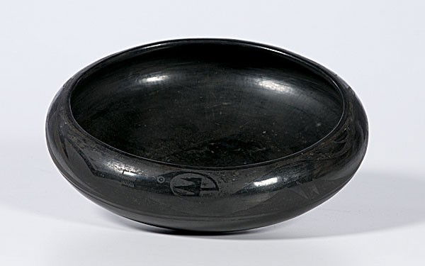 Tonita Roybal San Ildefonso Blackware Bowl : Tonita Roybal San Ildefonso Blackware Bowl shallow bowl with Avanyu slithering around rim; signed on base Tonita, height 3 in. x diameter 11 in. second quarter 20th century