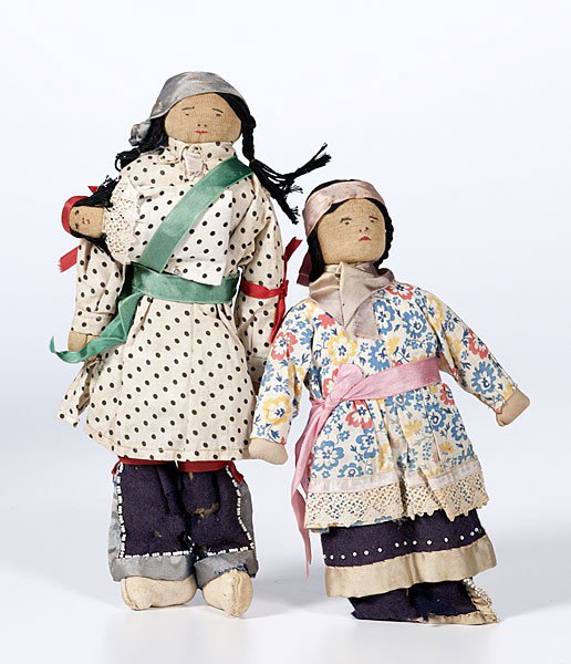 Great Lakes Doll Family : Great Lakes Doll Family lot of 2, possibly Winnebago; thread-sewn with patterned cotton tunics; beaded wool leggings edged with silk ribbon, lengths 12.5 in. and 10.5 in. early 20th century