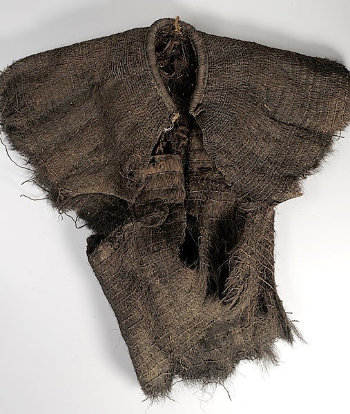 Melanesian Rain Cape : Melanesian Rain Cape woven of palm fiber resembling a vest with cape over shoulders, length 26". Property of the Children's Museum of Indianapolis
